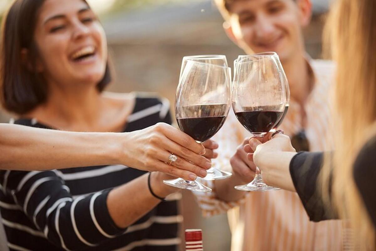 a group of people holding glasses of wine
