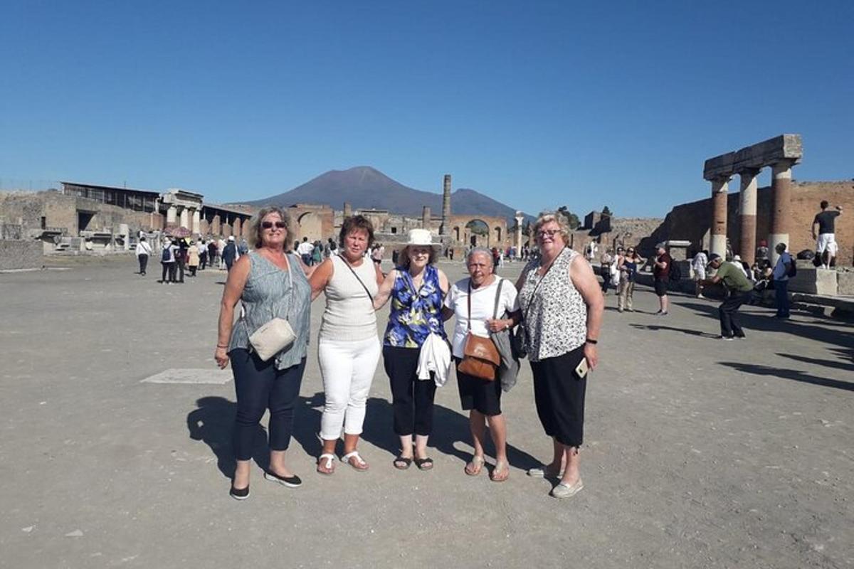 a group of women standing in a parking lot