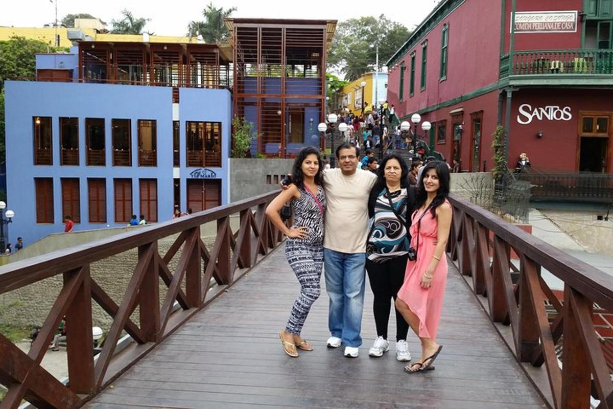 a man and three women standing on a bridge