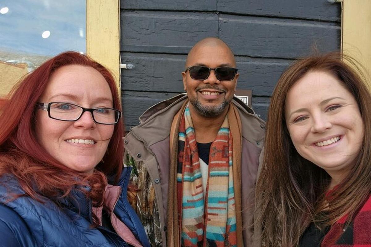 a man and two women posing for a picture
