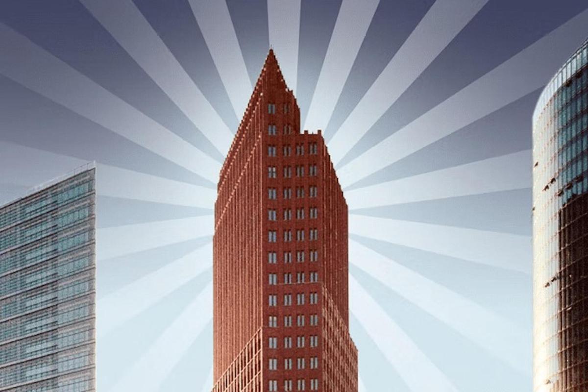 a tall red building in the middle of two other buildings