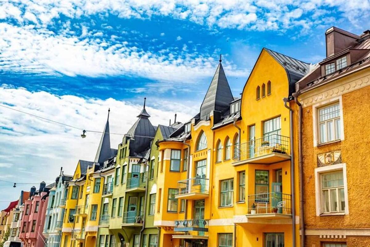 a row of colorful buildings with pointed roofs