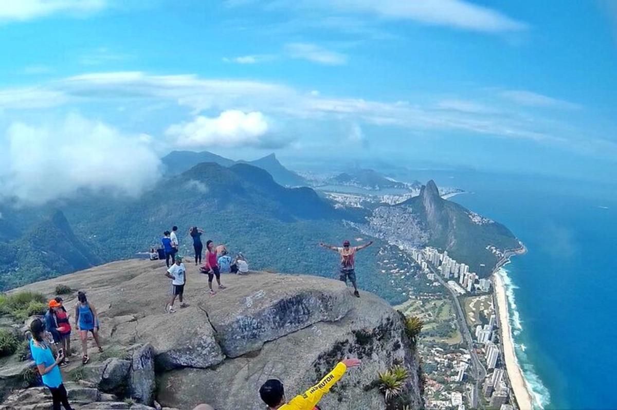 a group of people standing on top of a mountain