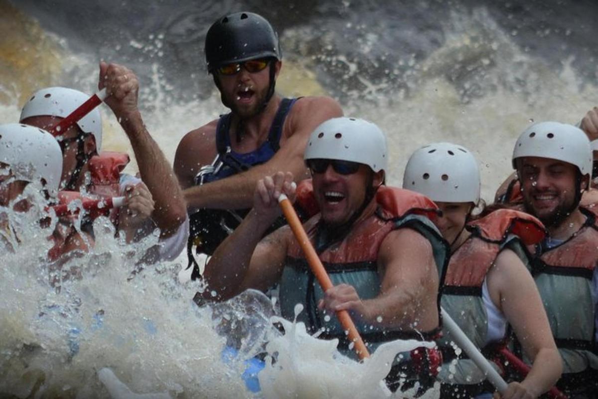 a group of people rafting on a river