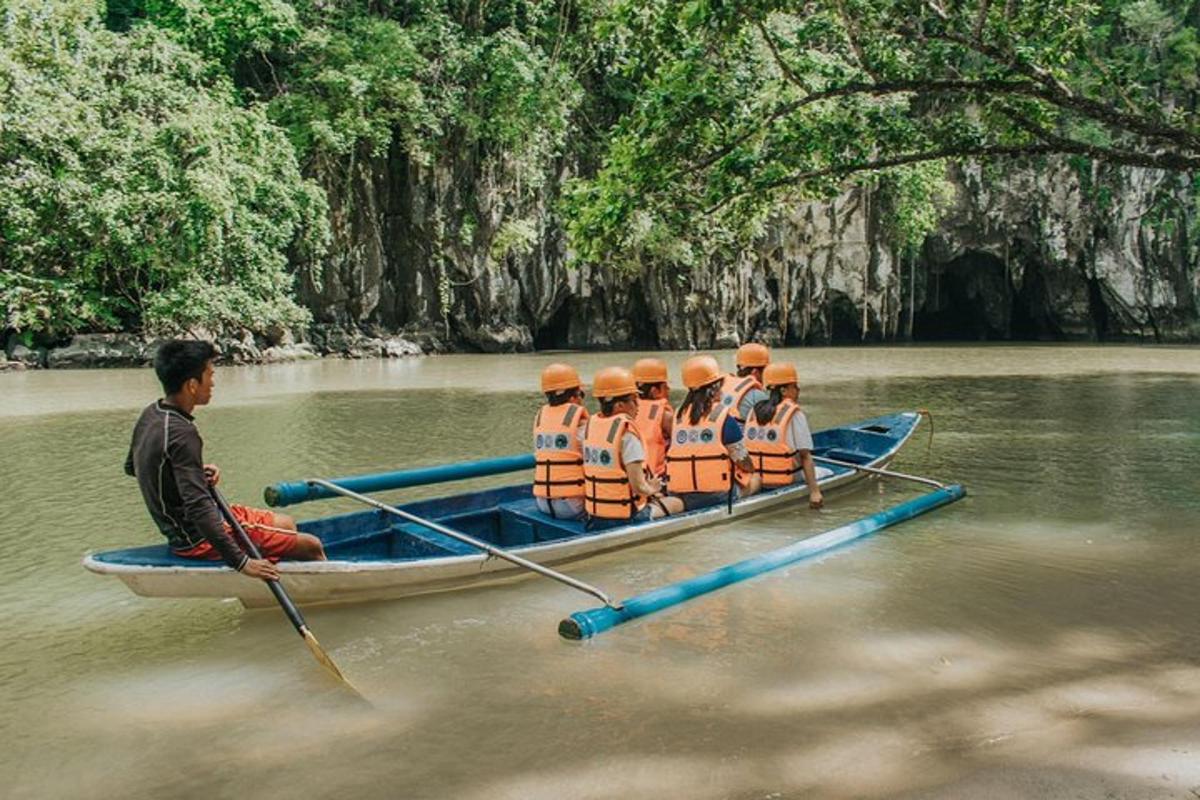 a group of people in a boat on a river