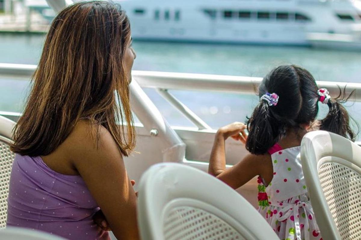 two little girls sitting on a boat