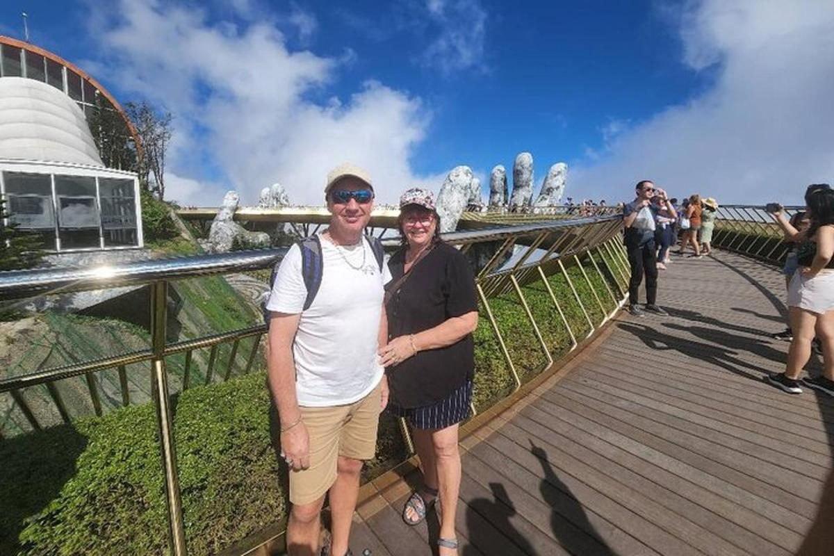 a man and a woman standing on a boardwalk