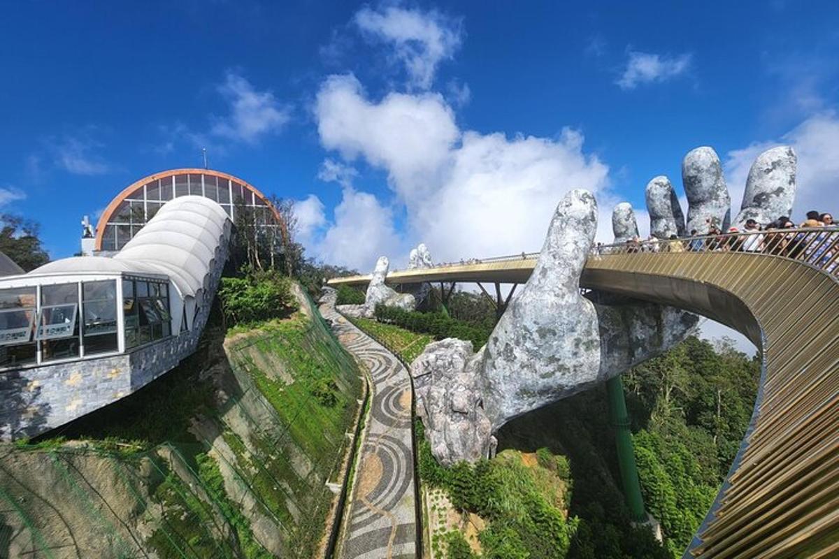 a group of people on a bridge over a mountain