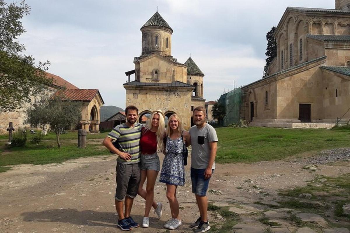 a group of people standing in front of an old building