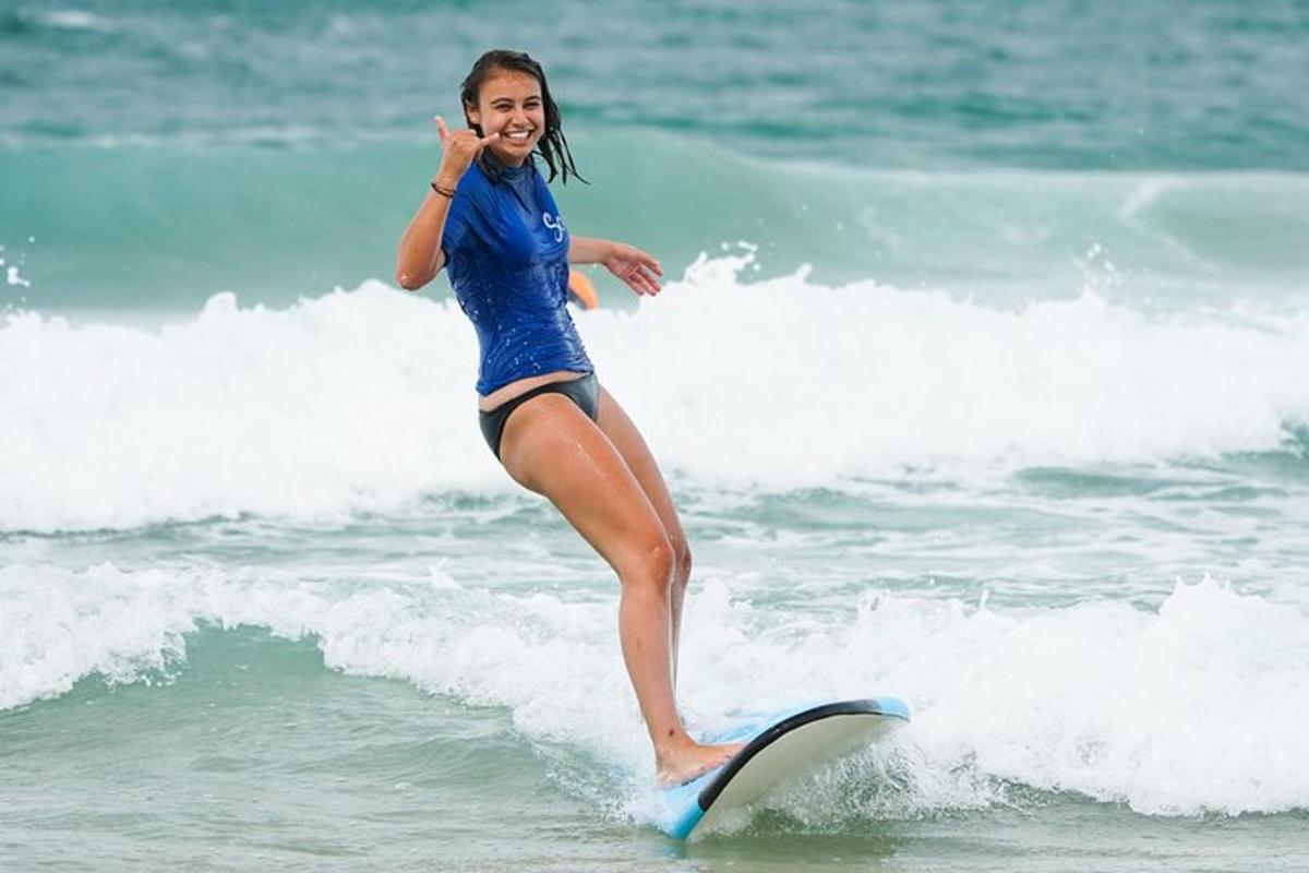 a woman riding a wave on a surfboard in the ocean