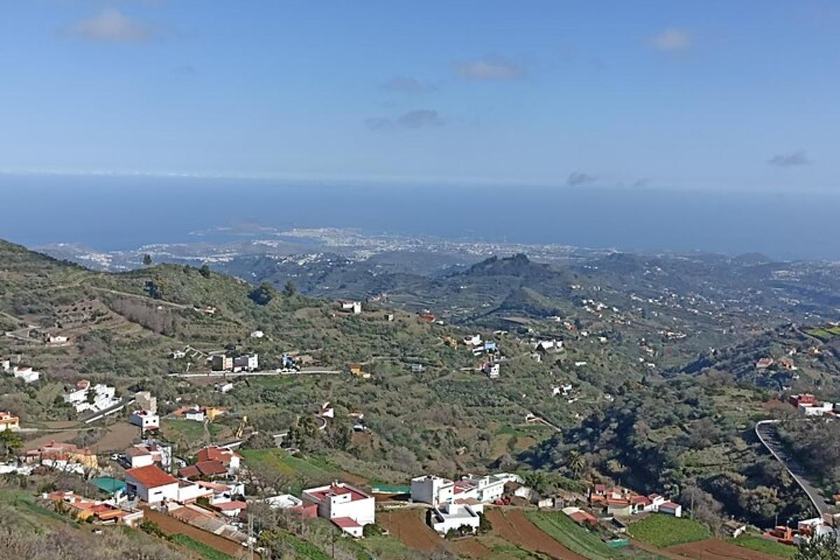 an aerial view of a town on a mountain
