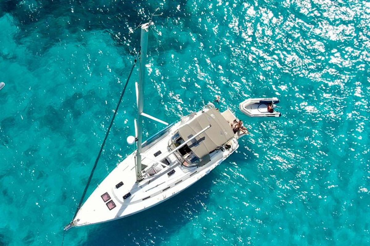 a white boat floating in the blue water