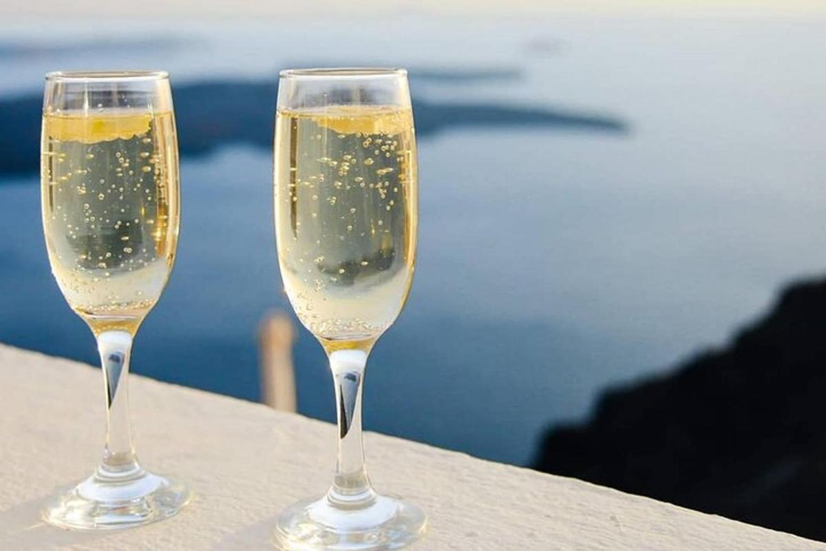two glasses of champagne sitting on a table