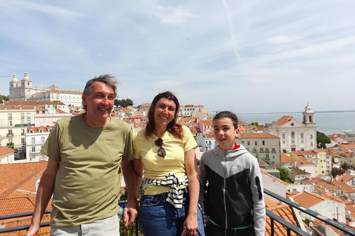 a man and a woman and a child standing on top of a city