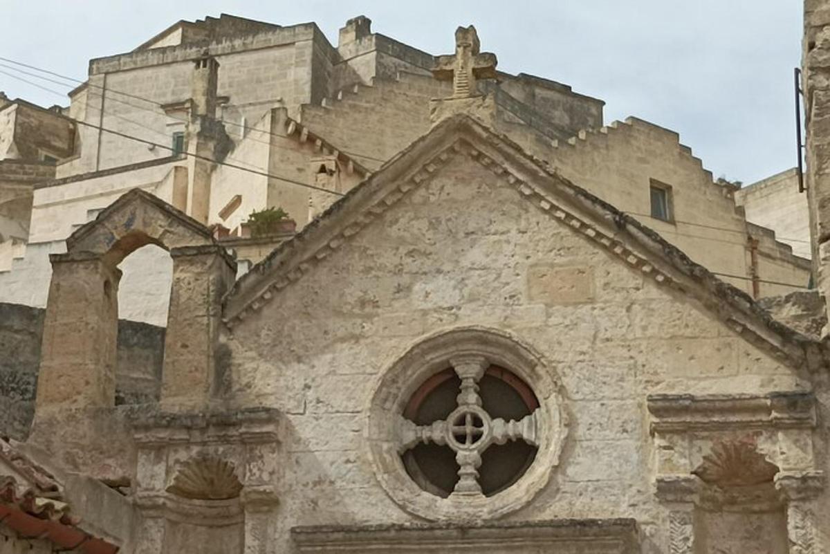 an old stone building with a window in front