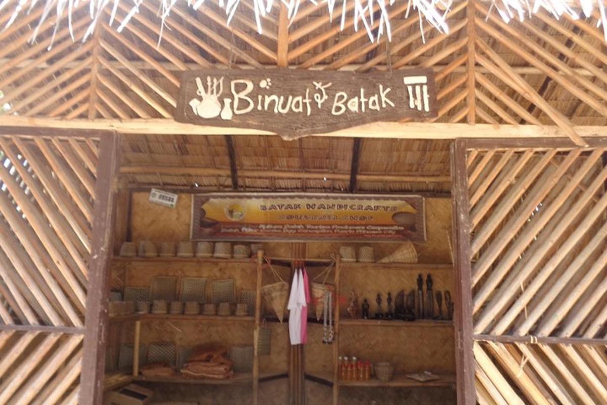 a wooden barn with a sign on the ceiling