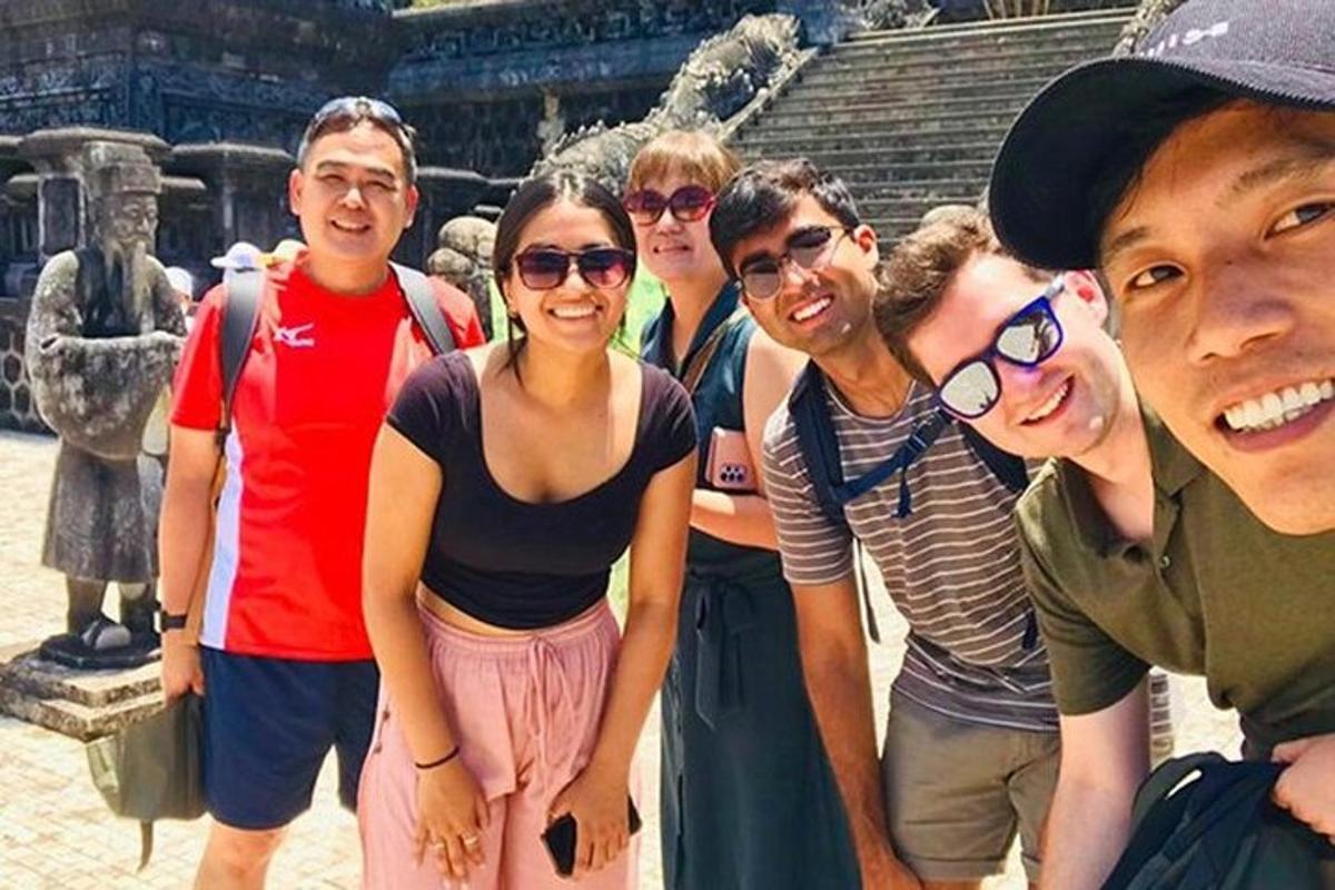 a group of people standing in front of a statue