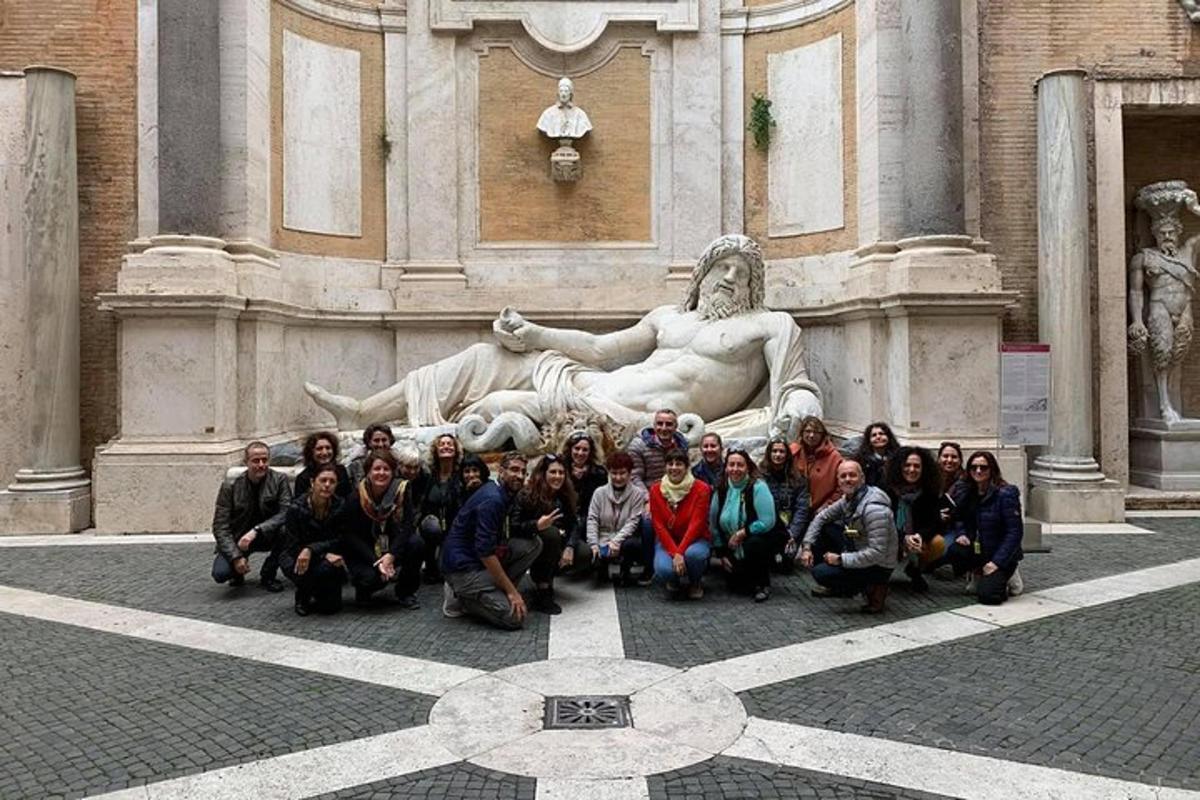 a group of people posing in front of a statue