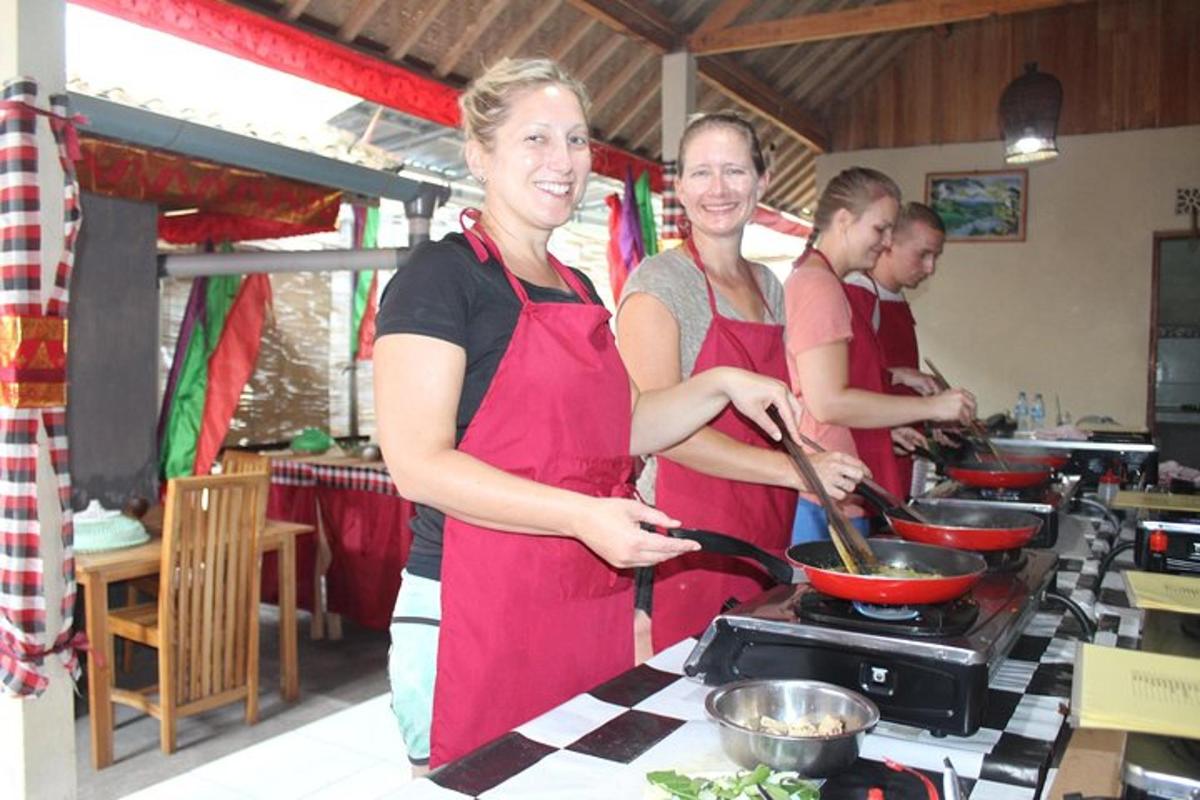 a group of people in a kitchen preparing food
