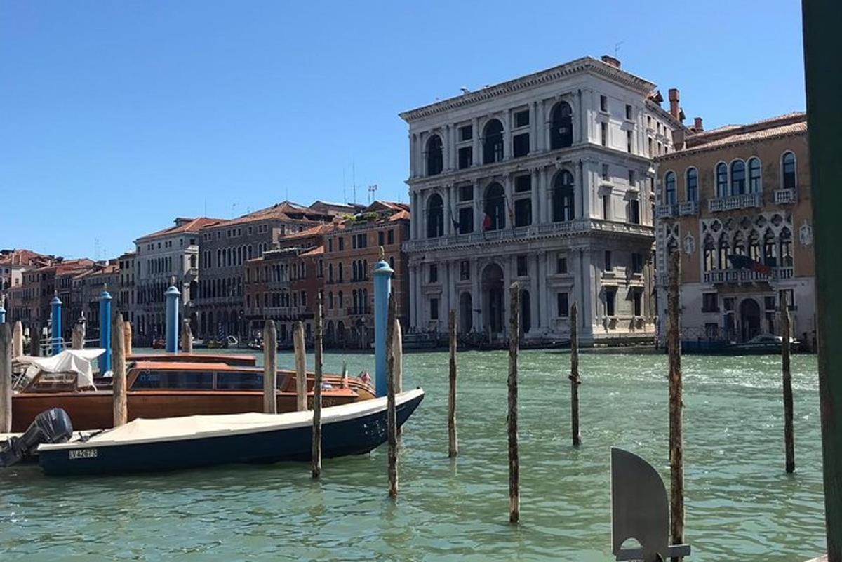 a boat in the water in front of buildings