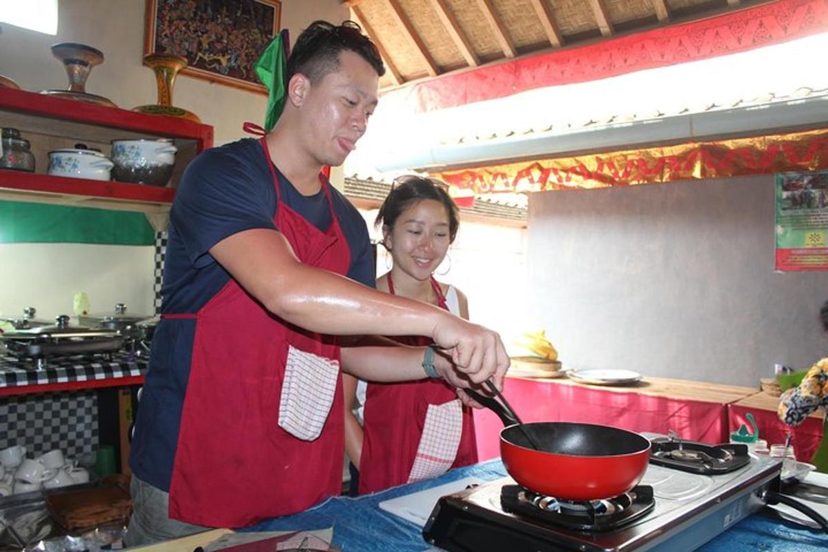 a man and woman preparing food in a kitchen