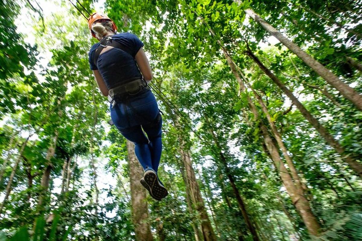 a man is jumping in the air in the trees