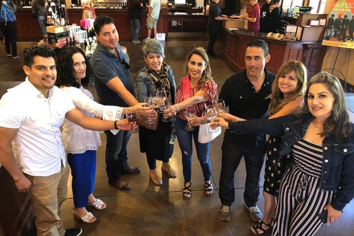 a group of people holding up their wine glasses