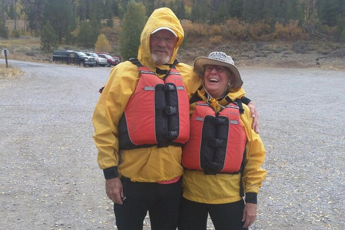a man and woman dressed in yellow and red