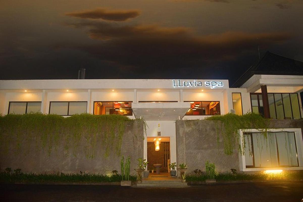 a white building with a sign on it at night