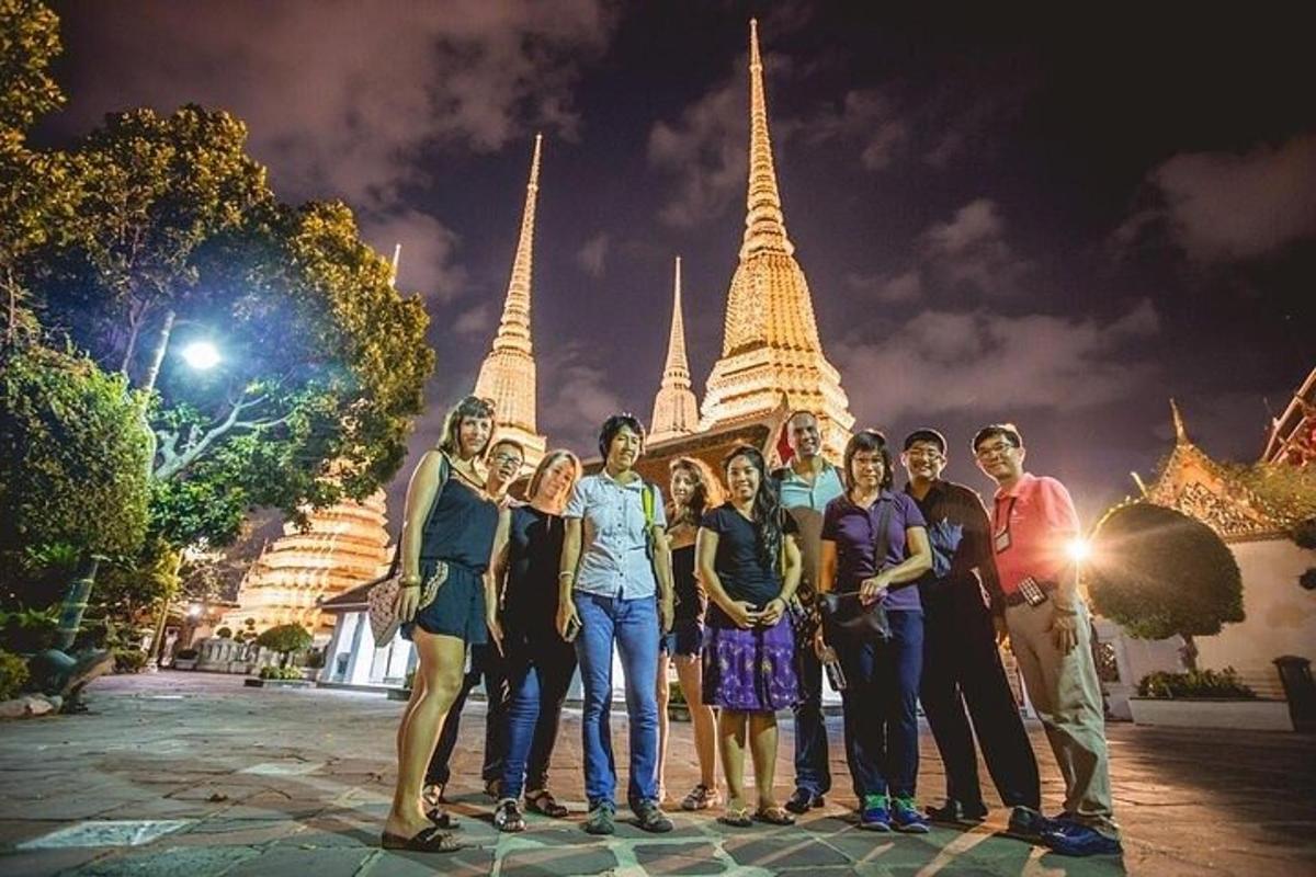 a group of people standing in front of a temple