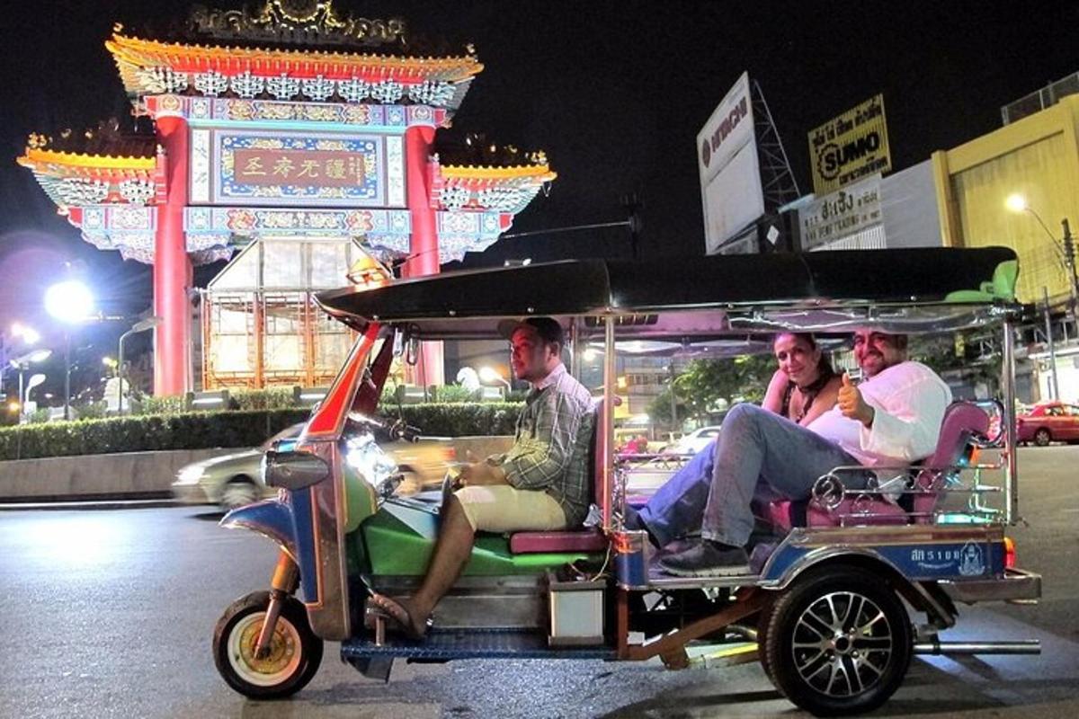 a group of people riding in a golf cart
