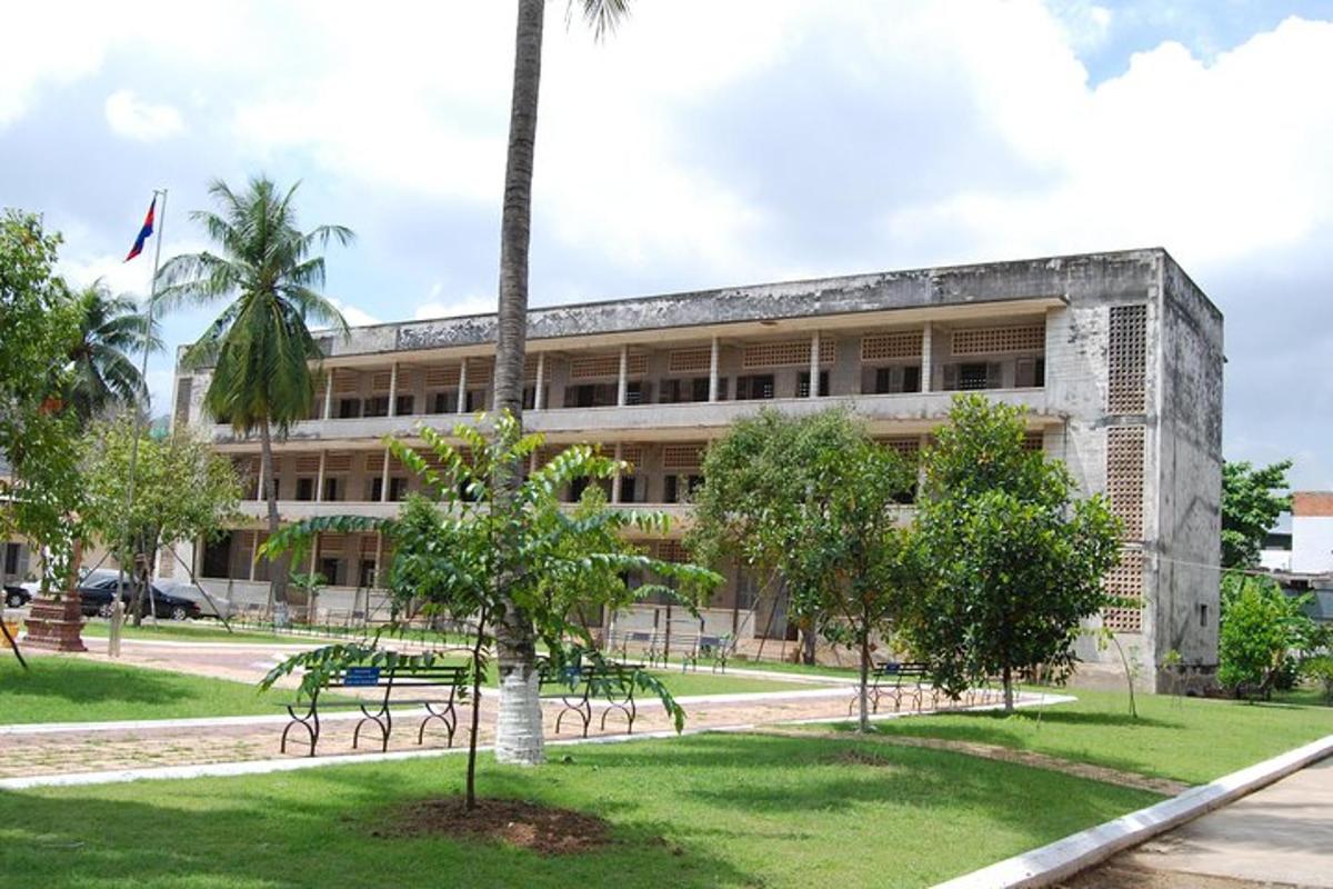 a building with a palm tree in front of it