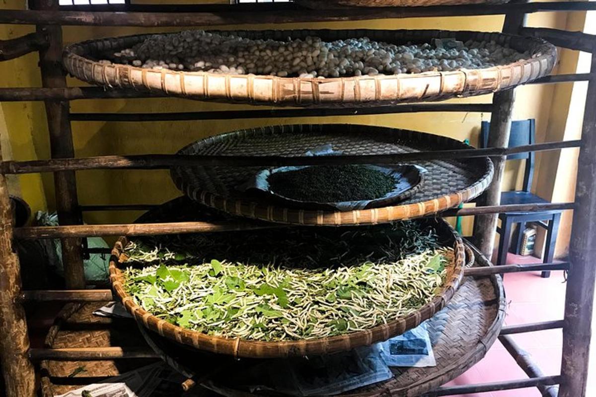 three baskets with plants in them on a shelf