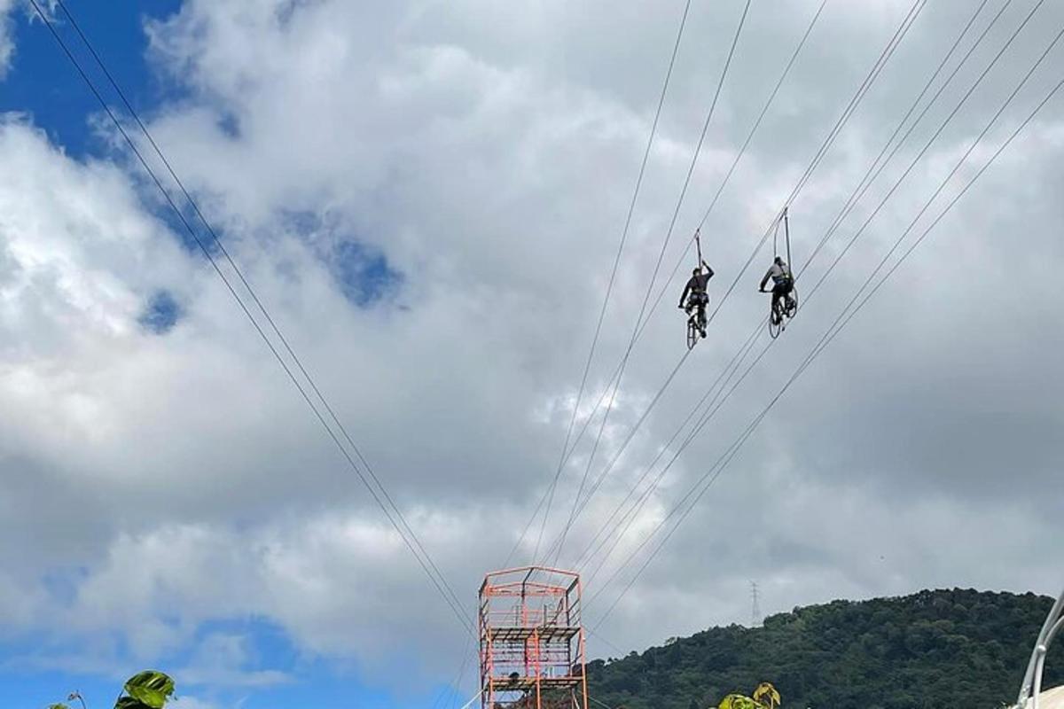two people on bikes are riding through the wires