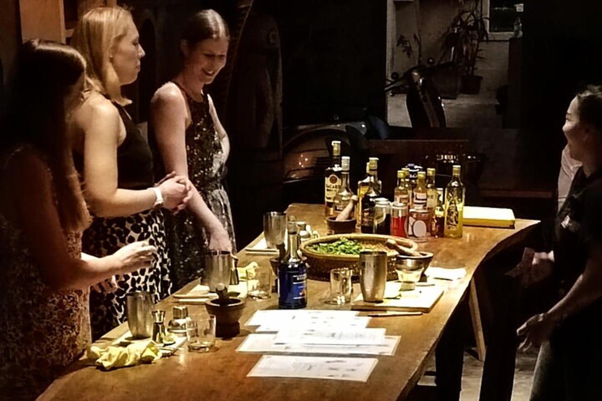 a group of women standing around a table