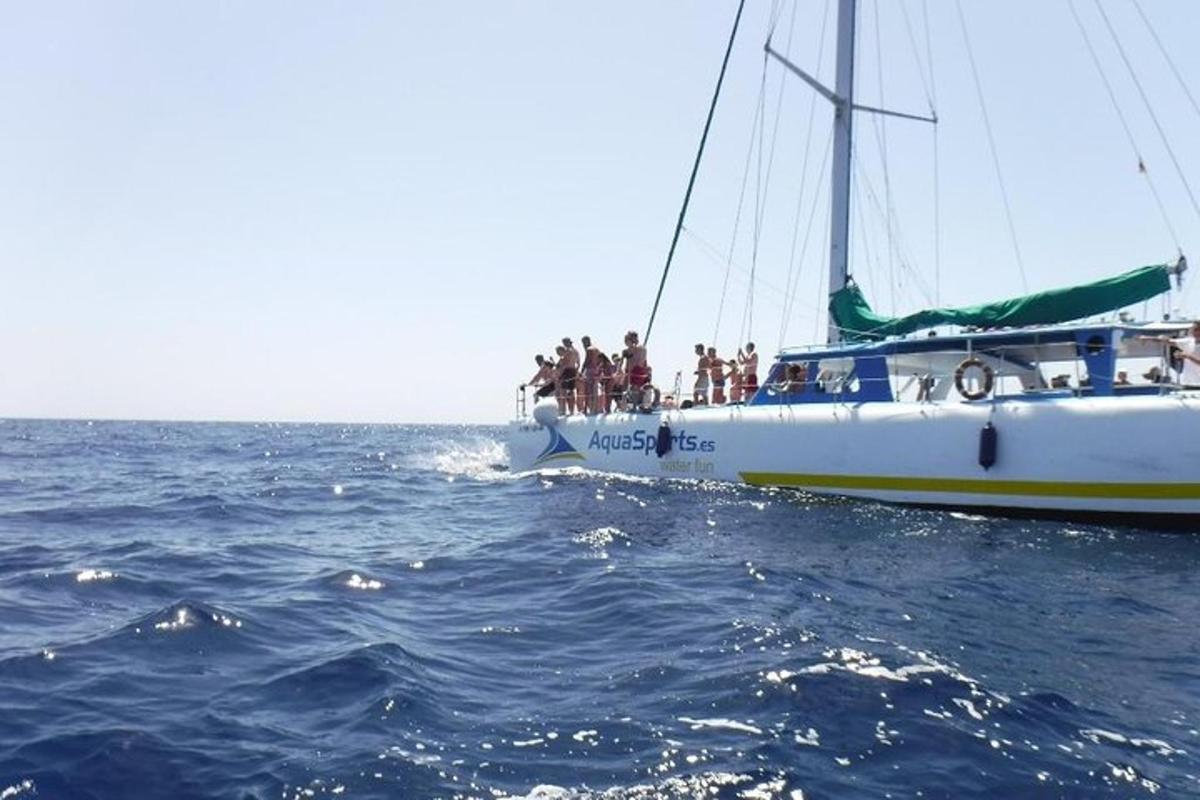 a group of people on a boat in the ocean