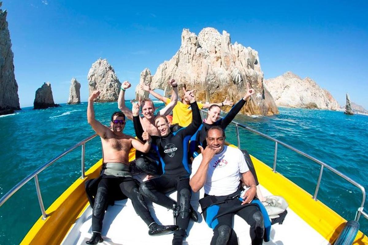 a group of people sitting on a boat in the ocean
