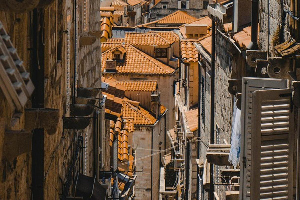 an overhead view of roofs of buildings in a city