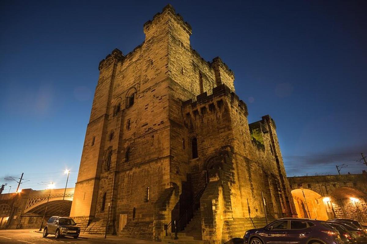 a large stone building with cars parked in front of it