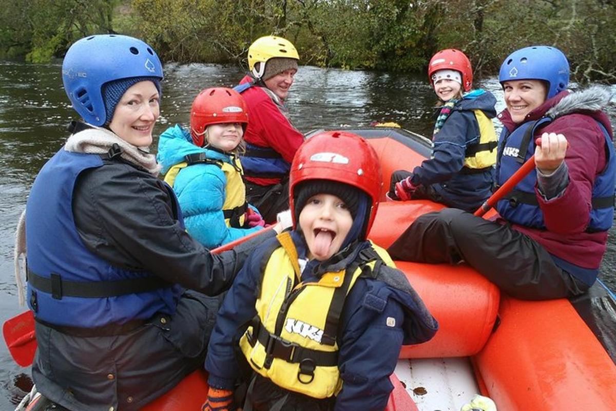 a group of people in a raft on a river