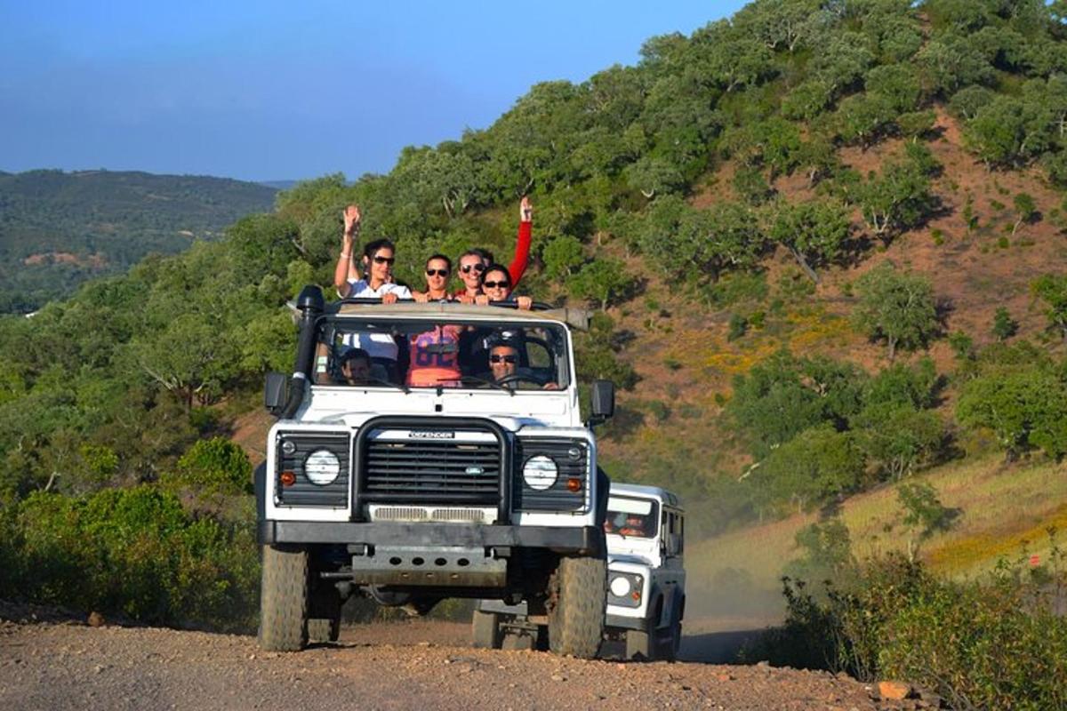 a group of people riding in the back of a truck