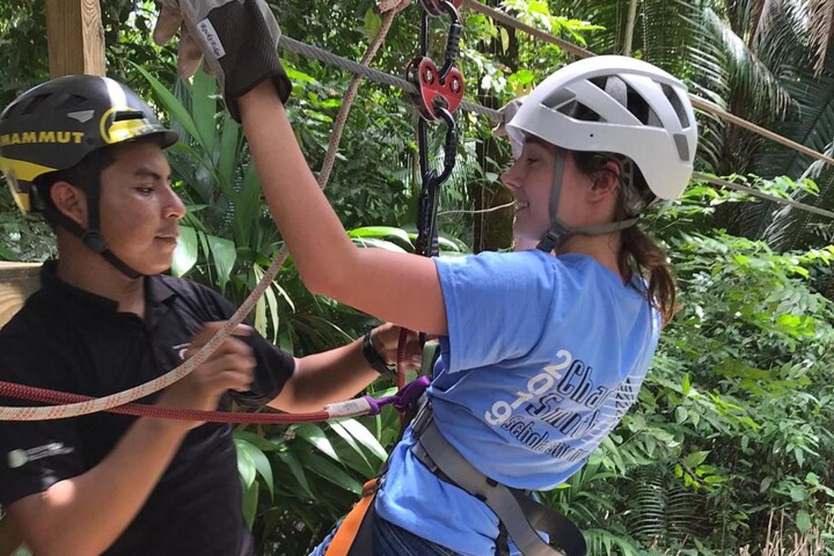 two people on the ropes in the jungle