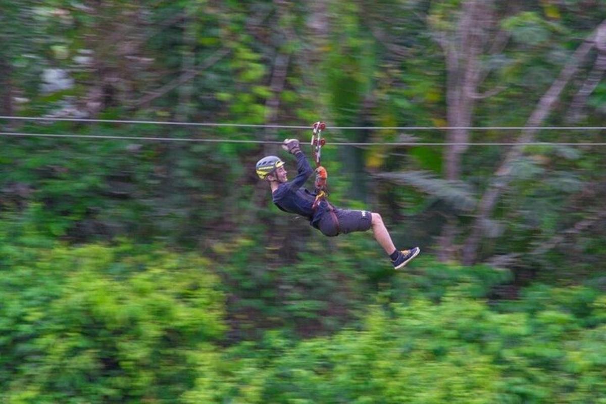 a person in the air on a parachute