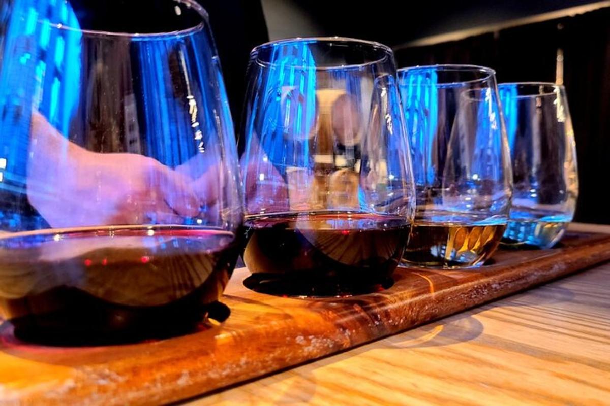 a group of wine glasses sitting on a wooden table