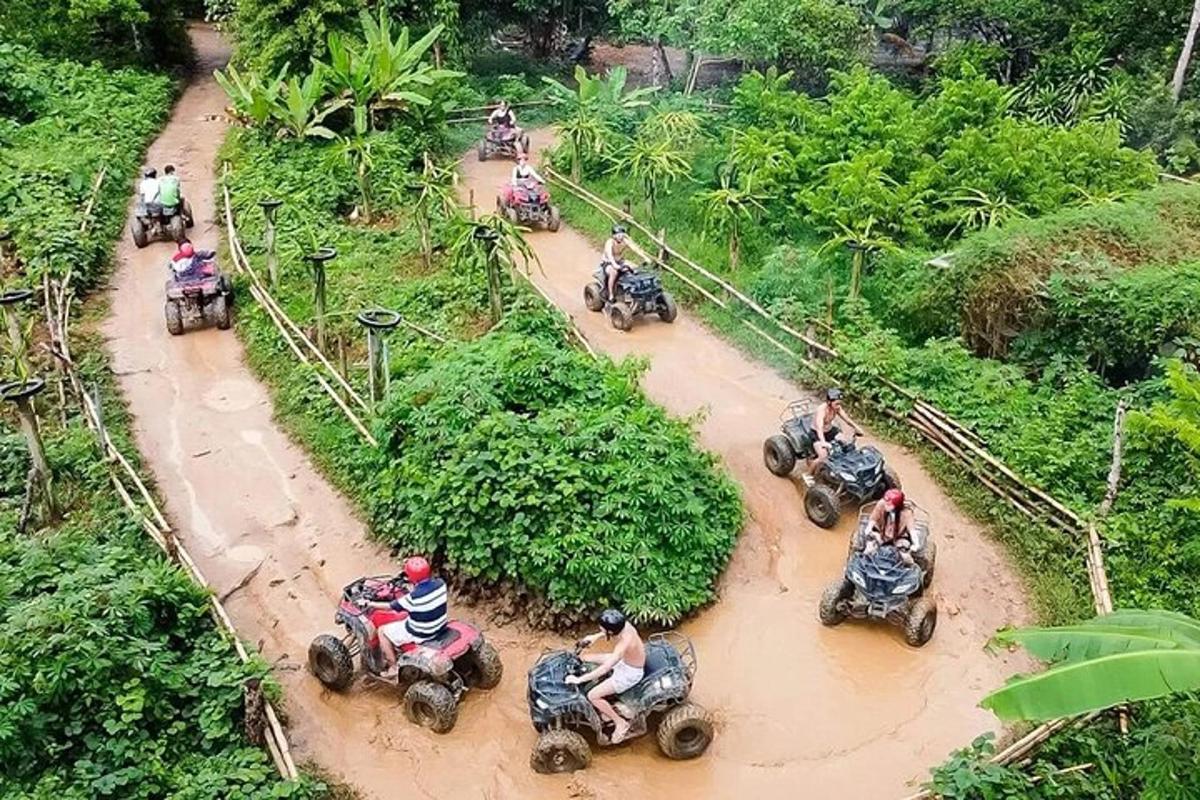 a group of people riding on motorcycles in a muddy road
