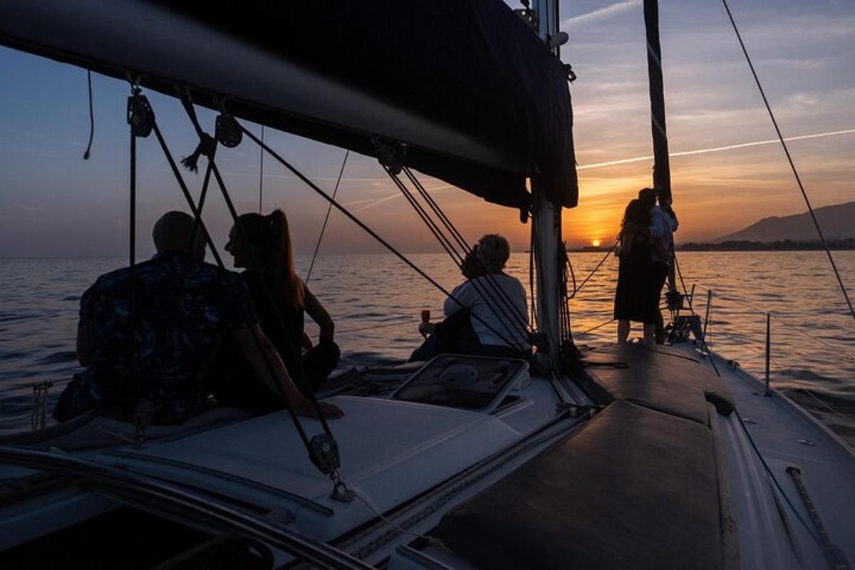 a group of people sitting on a boat in the water