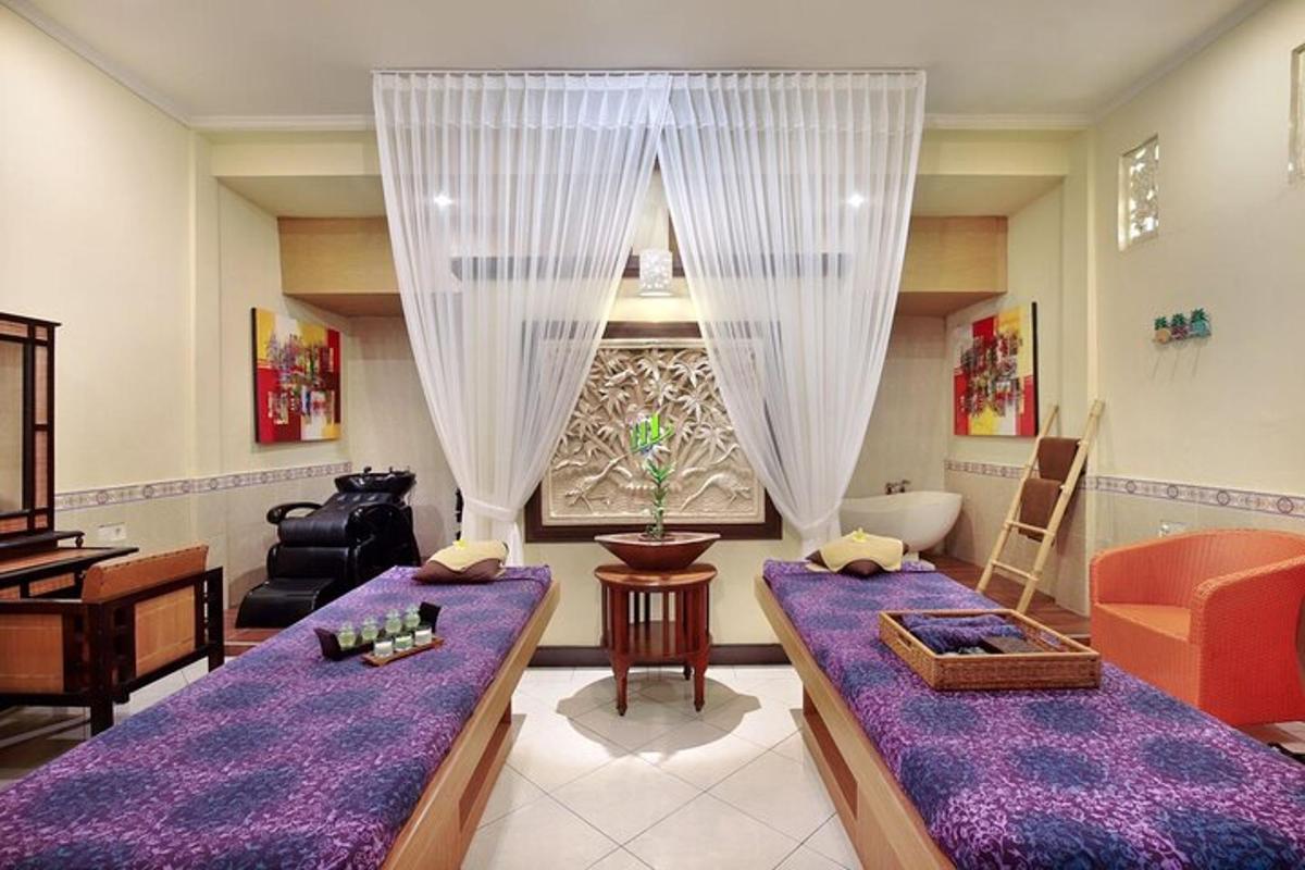 a living room with two beds and a couch