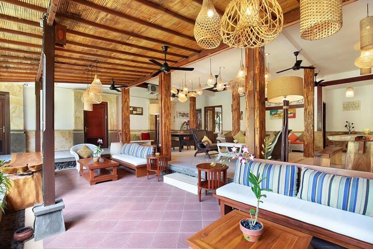 a living room with couches and tables in a room