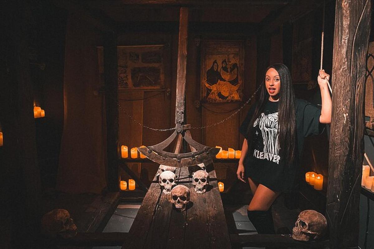 a woman is standing in a room with skulls