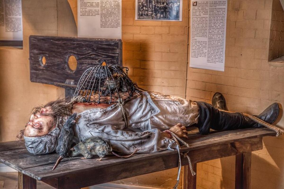 a statue of a man laying on a bench